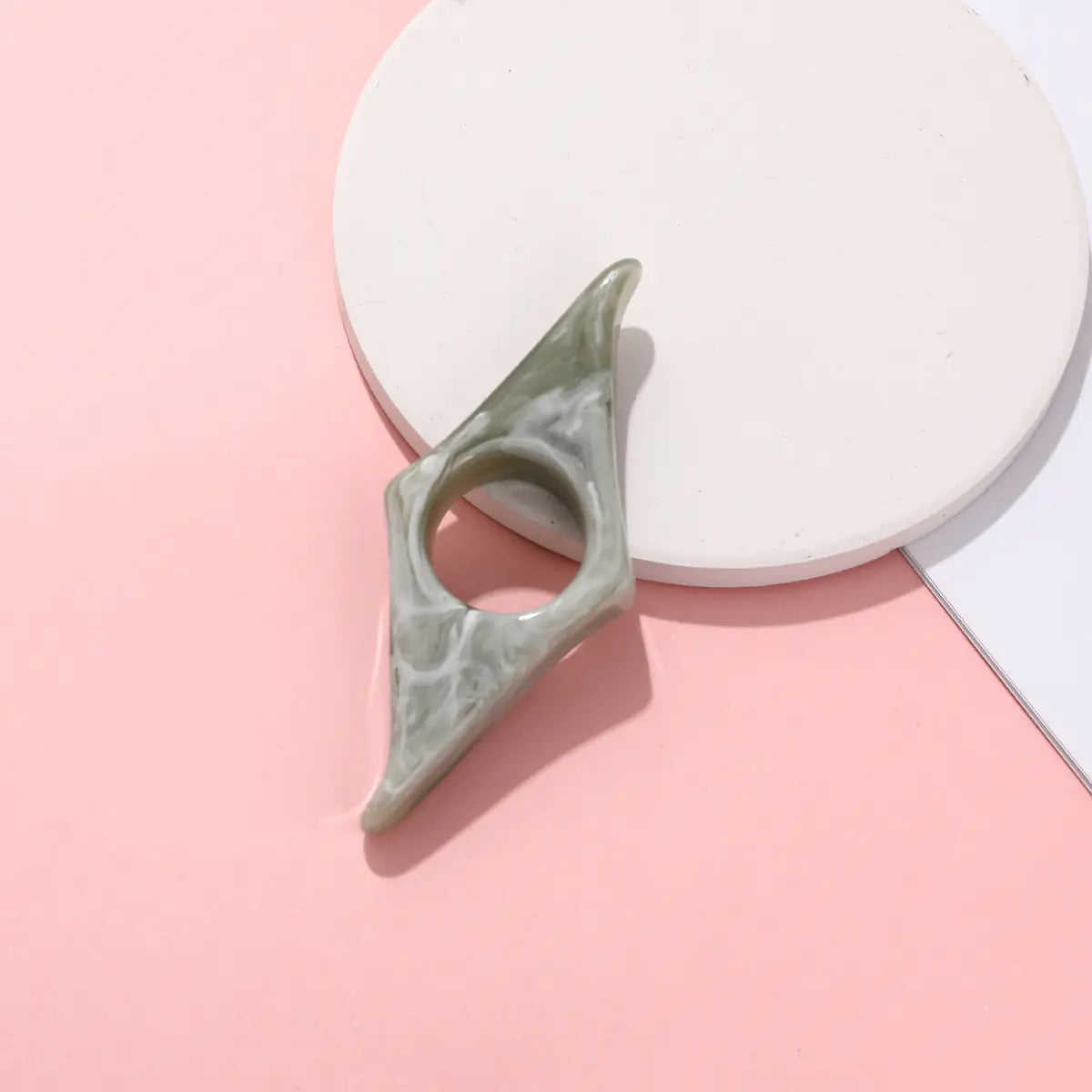 Support de livre en forme de pouce